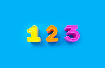 1 2 3 numbers isolated on a blue background. banner, bright toy, learning