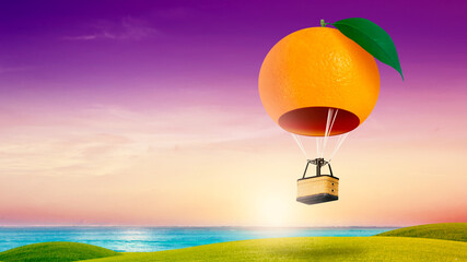 Orange fruit shaped hot air balloon, Hot air balloon floating over a green hill Elements of nature and sky background, Tourism and travel concept
