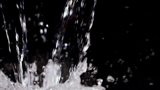 Water Splashing into black background in slow motion with wet liquid 240p