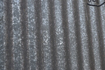Corrugated galvanized rusty metal sheet background with old aged rust texture on zinc tin or iron steel
