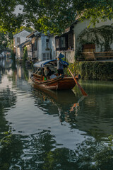 Obraz premium The sunrise view of the architectures and rivers in Zhouzhuang, a ancient Chinese village in Jiangsu, China.