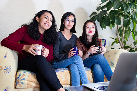 Three women looking at a computer