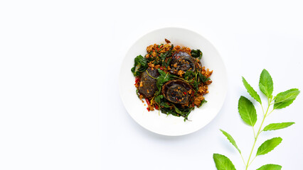 Thai food. Stir-fried minced pork, preserved egg  with basil leaves on white background.