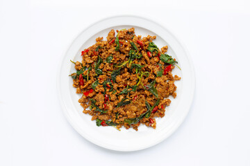 Thai food. Stir-fried minced pork with basil leaves on white