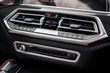 close up of  separate climate control in an expensive car. Conditioner and air flow control in a modern car