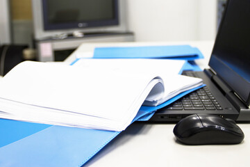 Blue Document folder with Notebook on table at office 