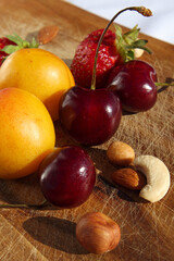 Fruit and berries on a cutting board proper food preparation home cooking foodphoto