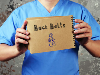 Medical concept about Back Belts  with phrase on the piece of paper.