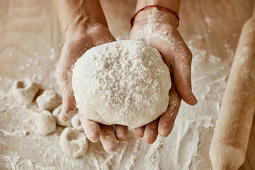 chef holding dough, woman chef holding dough, female hands in flour