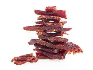 Beef jerky pieces isolated on a white background. Portion of beef jerky.
