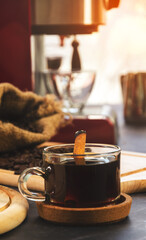 Cup of coffee with cinnamon stick.