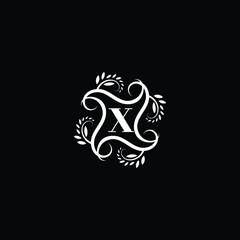 Initial Letter X Flourish circle monogram logo.