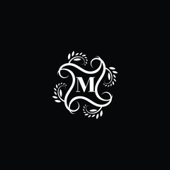 Initial Letter M Flourish circle monogram logo.
