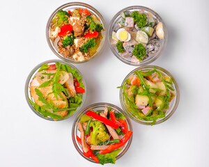 Healthy food - mix vegetable salad served in a bowl over white background. Healthy eating, delicious snack or dinner.