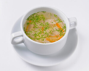 A picture of a bowl of traditional chicken soup served in a bowl over white background.
