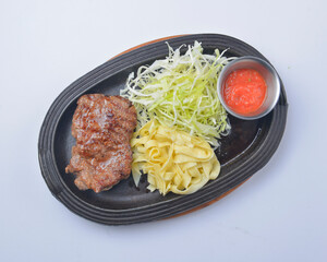 Juicy grilled barbecue steak served over white background. Delicious bbq meat concept