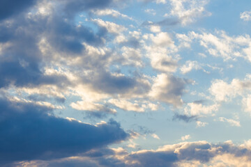 Naklejka na ściany i meble cloudy sky in yellow light. natural background at sunrise. inspiring scene
