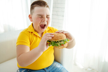A boy with metabolic disorders. Child with the problem of childhood obesity. Overweight obese fat boy. High quality photo.