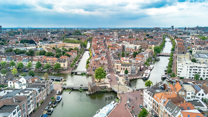 Naklejka na ściany i meble Aerial drone view of Leiden town cityscape from above, typical Dutch city skyline with canals and houses, Holland, Netherlands 