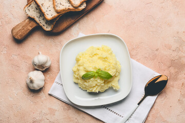 Composition with tasty mashed potato and garlic on table