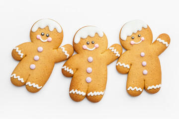 Tasty gingerbread cookies on white background