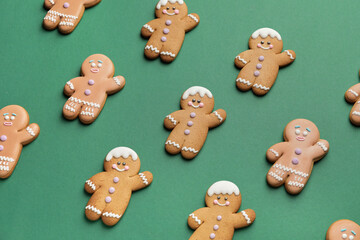 Tasty gingerbread cookies on color background
