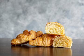 croissants on the table, ready to serve or sell in the coffee cafe, closeup layer of croissants 