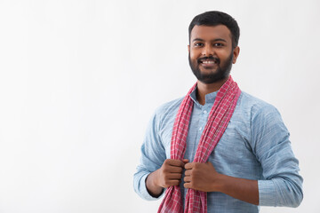 PORTRAIT OF A RURAL MAN SMILING AND POSING IN FRONT OF CAMERA
