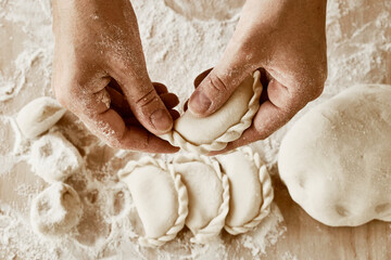 baker's hands, dough, baker sculpts dumplings, hands in flour, dumplings, handmade dumplings, ravioli