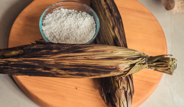 Brazilian traditional dessert. Bolo de tapioca (mane doido, pe de zumbi or pe de moleque nordestino similar to carim&atilde;, cassava cake). Brazilian cake made from tapioca flour, wrapped in banana leaves.