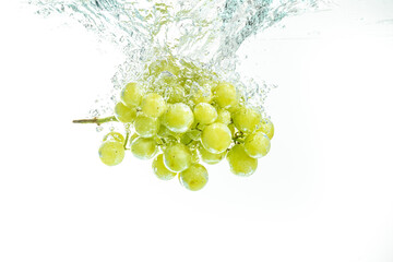 Fresh Muscat white Grapes Falling Into Water with splash Isolated on White Background