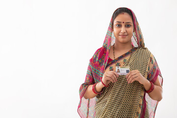 PORTRAIT OF A RURAL WOMAN WITH IDENITITY CARD IN HAND
