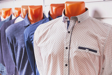 Samples of summer men's shirts dressed on mannequins and ready for sale to customers