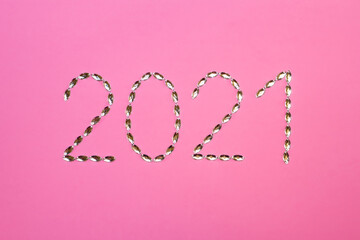 rhinestones for needlework on a pink background. number of the new year. 2021.