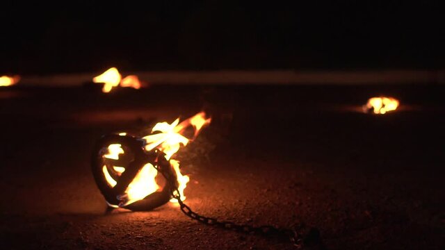 The fire burns in the props intended for the fire show. Demonstration start with fire, background, copy space for text, slow motion