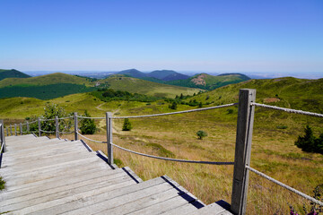 stairs wooden walking path in puy de dome french mountains volcano