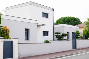 Fototapeta na wymiar modern white exterior of newly built luxury home