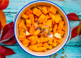 Ingredients for homemade pumpkin jam on a wooden background.