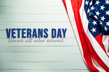 Fototapeta na wymiar Veterans day. Honoring all who served. American flag on wooden background.