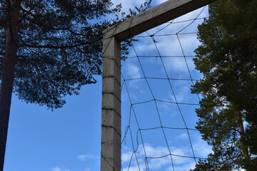 Plakat Football goal with trees and sky