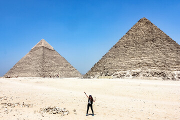 Egypt, Giza Girl tourist in the desert of ancient Cairo. Excursion. Pyramids.