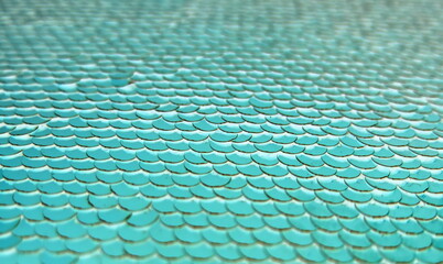 Blue beautifully laid out sequins in the form of fish scales © NADEZHDA
