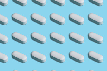 White pills seamless pattern on blue background. 