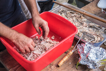 Obraz premium Removing bones from cooked fish to prepare it for homemade fish soup