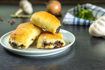 Close-up on yeast patties with mushroom-and-groats stuffing
groats