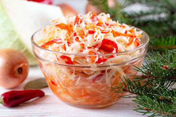 Homemade Sauerkraut with Carrot on table. Winter salad.
