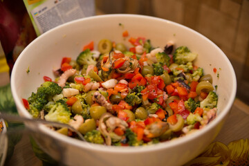 salad with seafood and vegetables on a home table