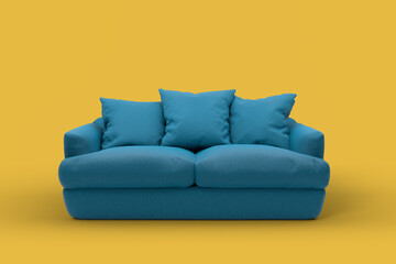 Emerald couch with pillows on studio yellow background.