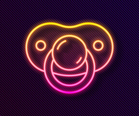 Glowing neon line Baby dummy pacifier icon isolated on black background. Toy of a child. Vector.