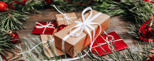 New year gifts on wooden background with christmas tree and toys